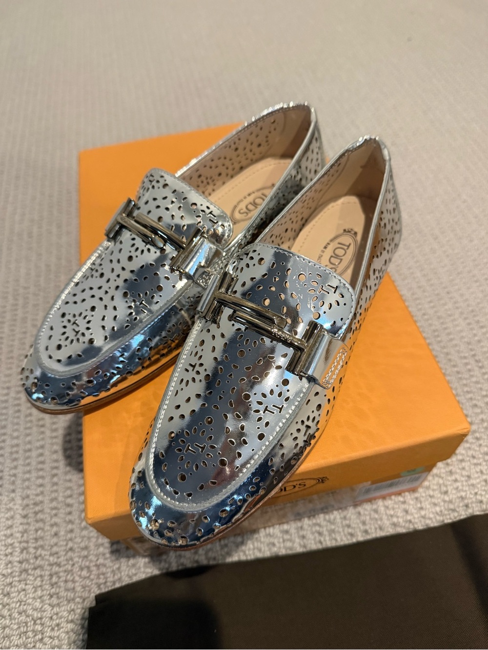 Tod’s Doppia T perforated metallic leathers in Argento Silver